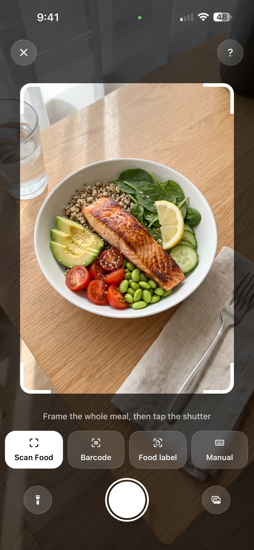 Calobook camera in Scan Food mode with a salmon quinoa bowl inside the frame